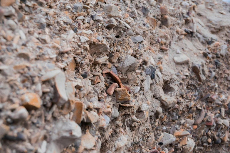 a red object is standing on the rock wall