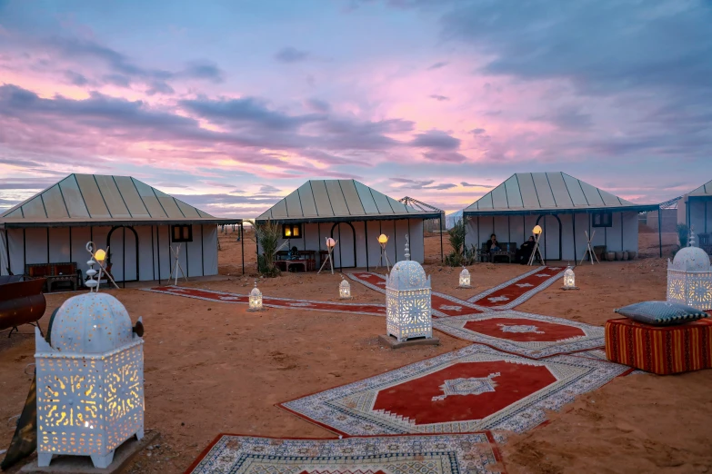 several white tents set up next to a pathway