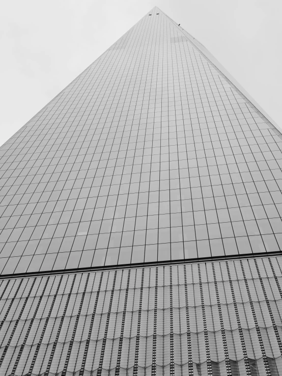 a very tall building that is covered in glass