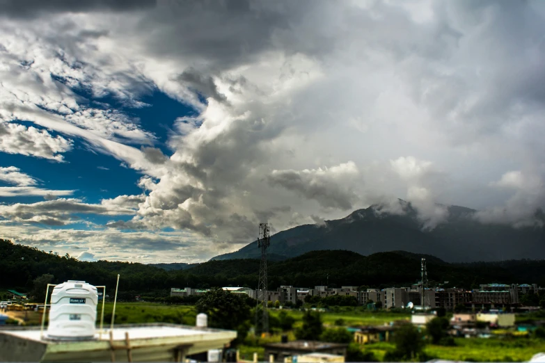 a large group of clouds over a rural town