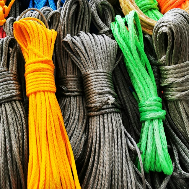 a bunch of colorful ropes all stacked up together