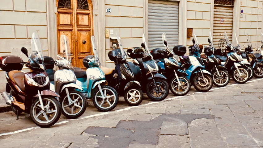 there are a group of motorcycles parked in front of the door