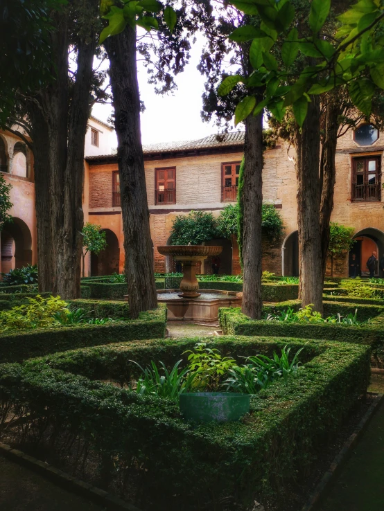 there is a plant courtyard that has hedges around it