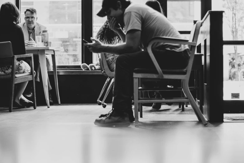 a man sitting at a table in a restaurant