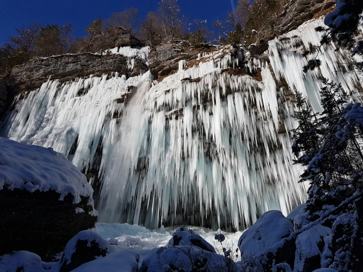 the water gusts from a frozen waterfall