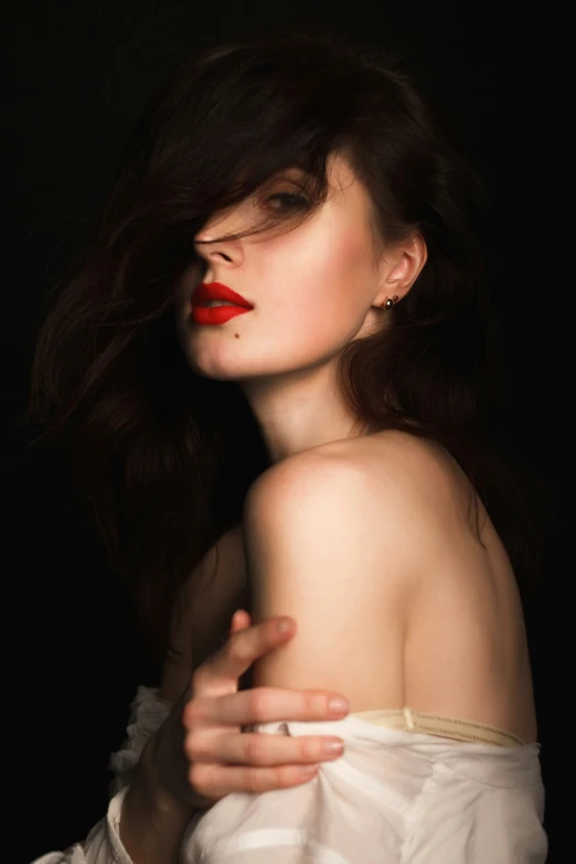 a girl in white with red lipstick posing