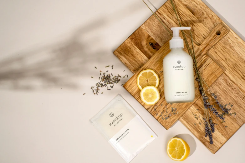 an overhead view of a bottle of lotion on a  board