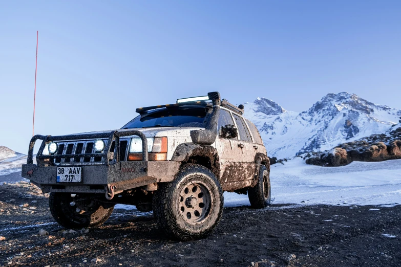 a large vehicle parked on the side of a mountain