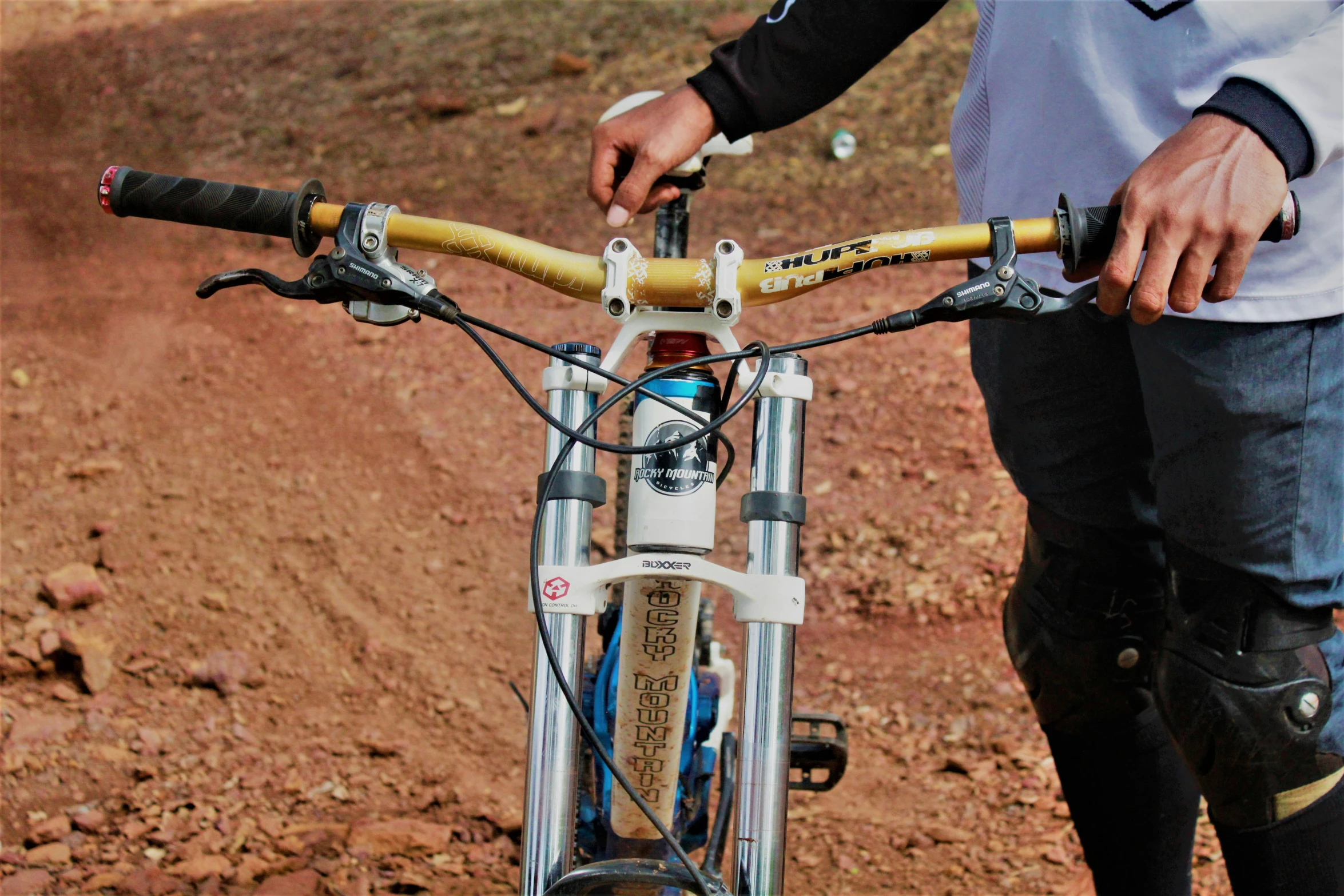 the handlebars and bars of a bicycle are visible