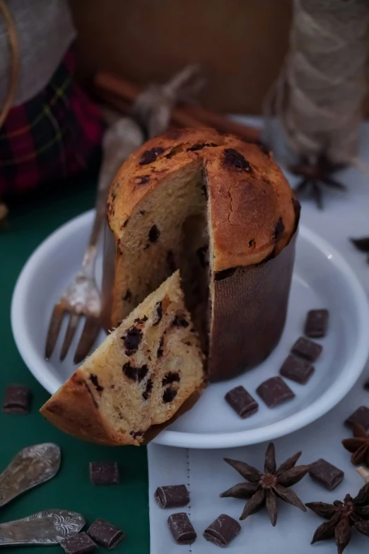 there is a partially eaten muffin on a white plate