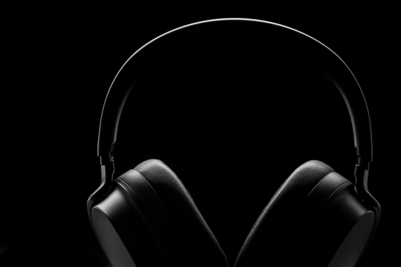 the headphones are placed side by side against a black background