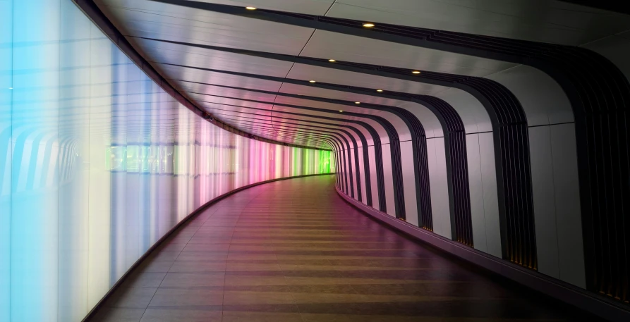 rainbow colored wall covering a large hallway