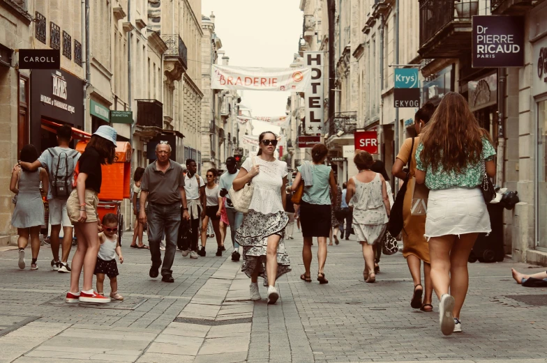 a group of people walking through an alley way