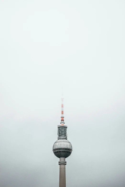 tall observation tower towering over the city in a foggy day