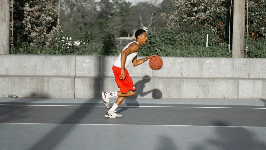 a man holding a basketball in his hands