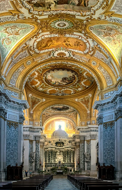 the inside of an ornate cathedral with gold decorations