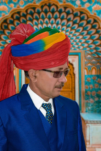 a man in a suit with an indian turban