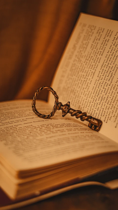 a book and a key lying on a chair