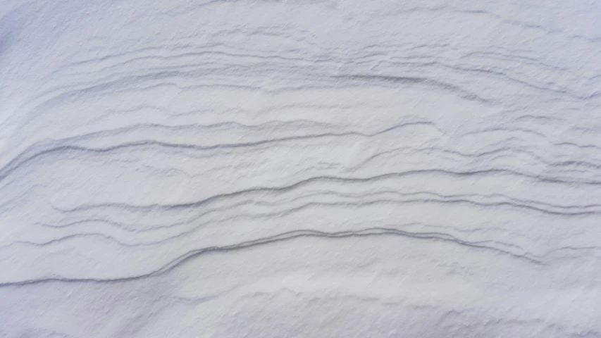 lines are drawn in the snow with a sky background