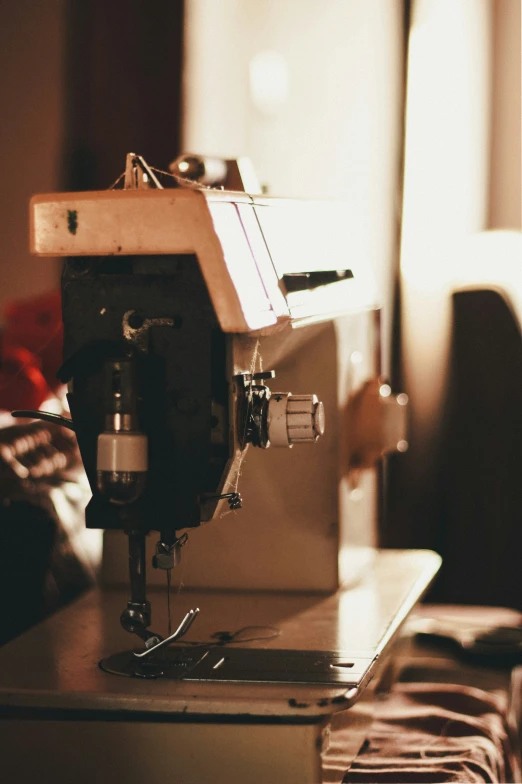 a sewing machine sitting on top of a wooden table