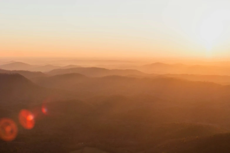 a po taken at sunset of some mountains