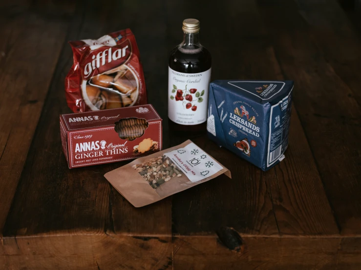 a table has spices, a box and some cookies