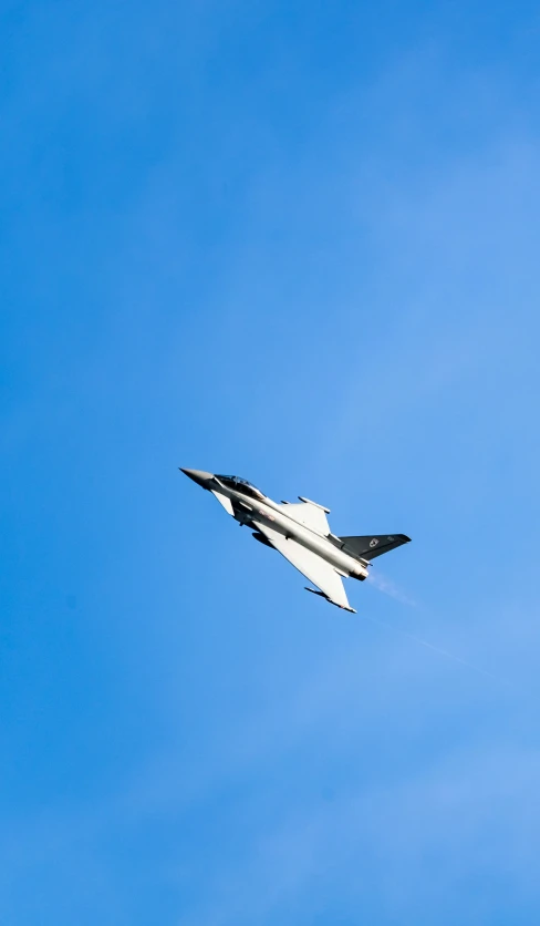 a space shuttle is flying against a blue sky