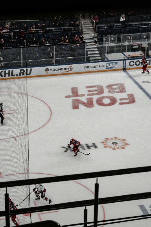 a view from a high angle over the goalie net at an ice hockey game