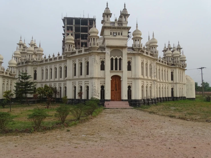 a white building with two towers and lots of windows