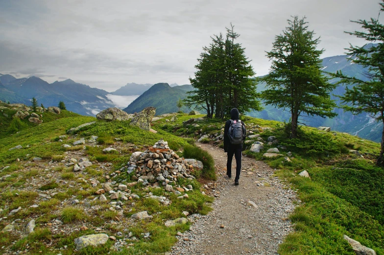 there is a man with a backpack on the mountain