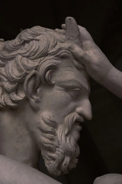 a close up of a marble statue of a man