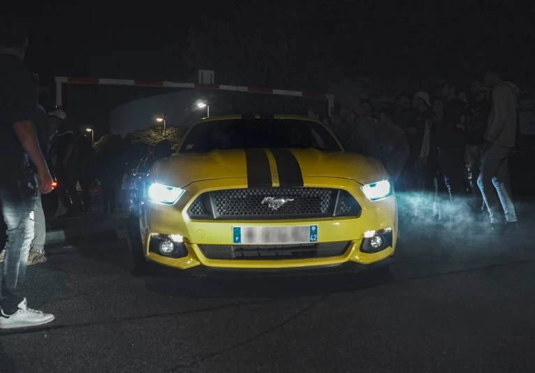 the front end of a car in the dark