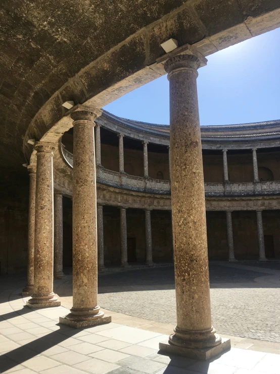 the inside view of an old building with three round columns