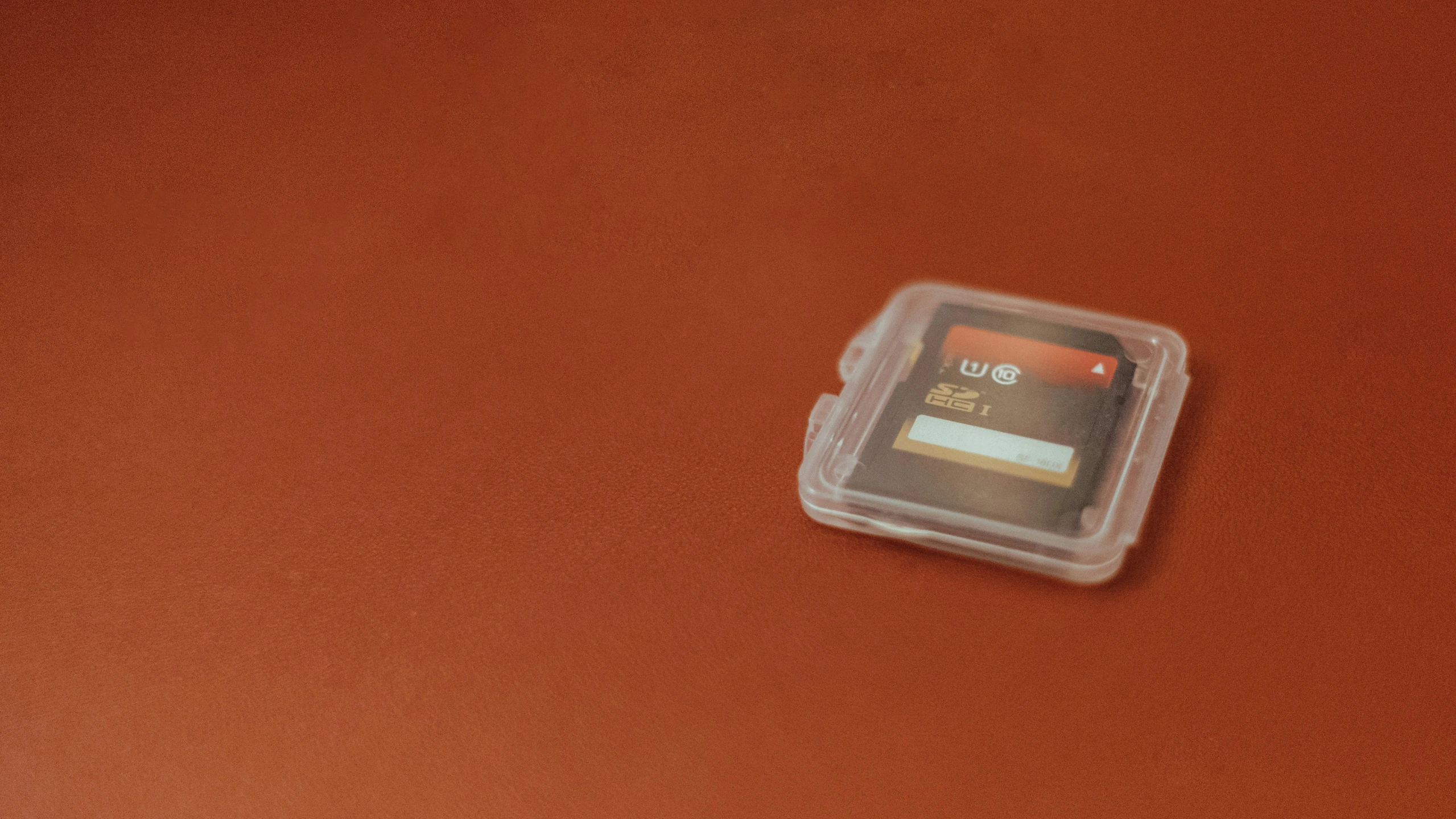 a small plastic container on top of a brown table