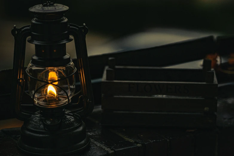 a lantern lite in the dark by a light source