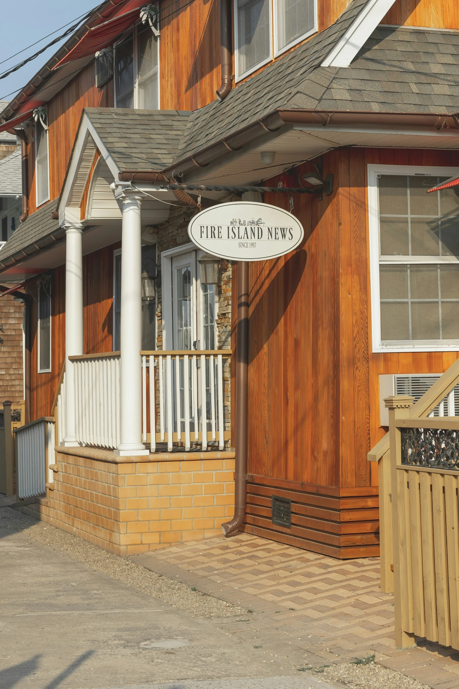 a brown and white house with a sign that reads the river view inn