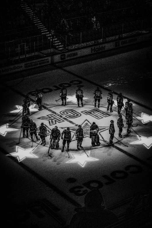 a ring of people standing around an arena