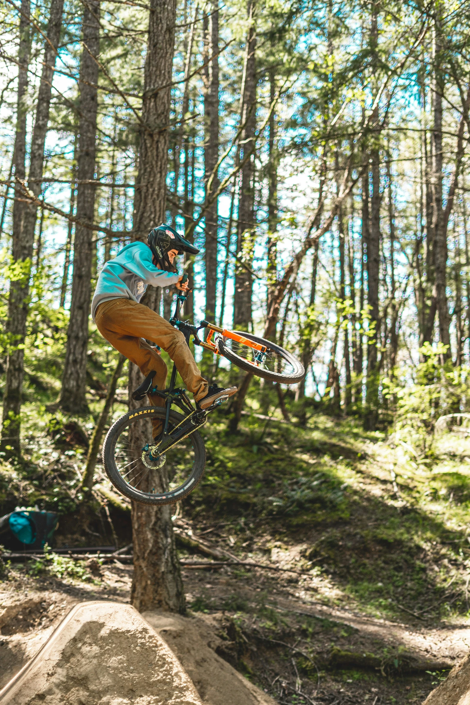 a man riding a bike up the side of a tree