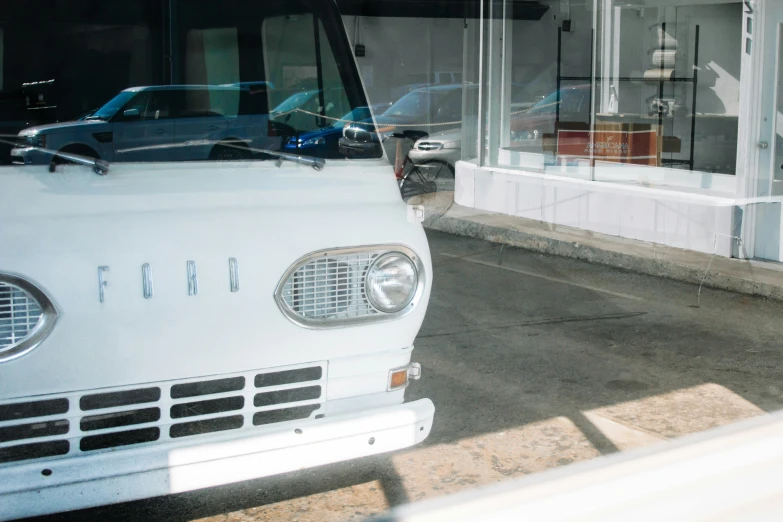 a white truck parked in front of a building