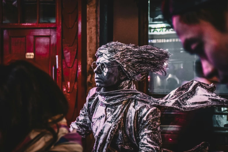 a statue of a woman standing with her hair in her hair