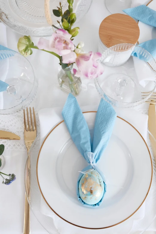 a white table topped with plates and cups