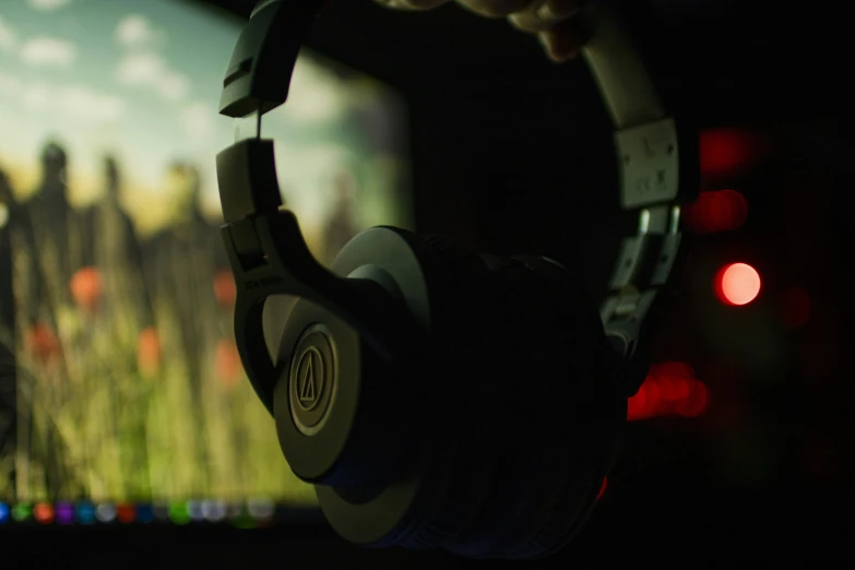 a black and white image of a person with headphones