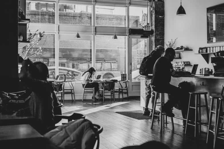 a black and white po of some people at a counter