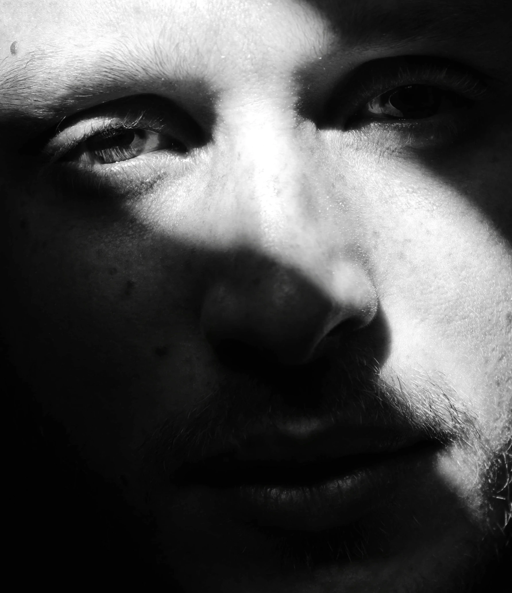 a close up of a young man with a moustache