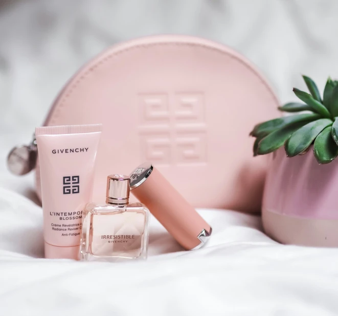 a few personal care products sitting next to a small potted plant