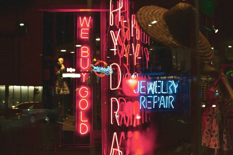 a variety of neon signs that are attached to poles