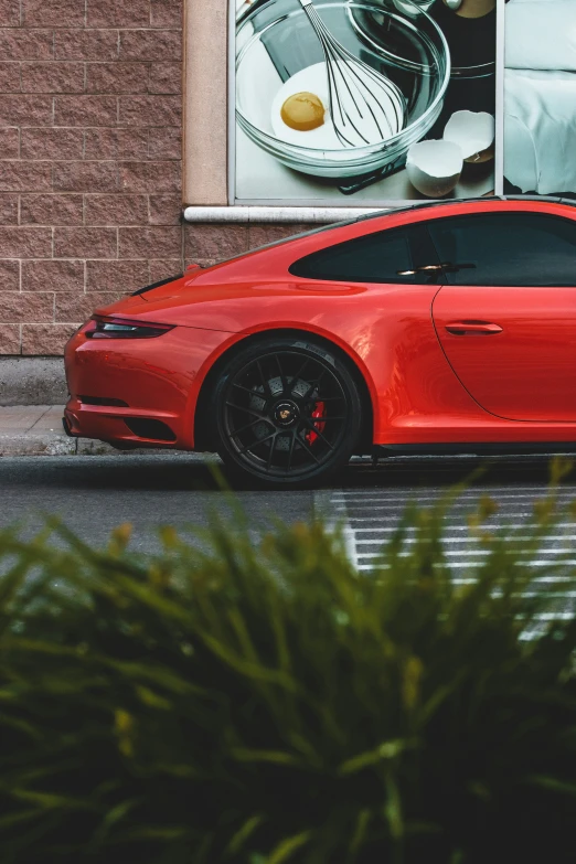 a red car parked on the side of the road