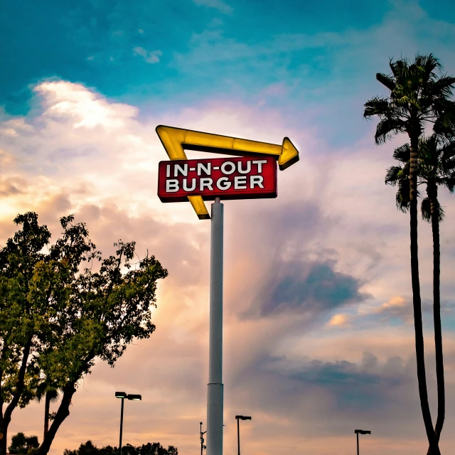 a sign with a large  dog bunger underneath