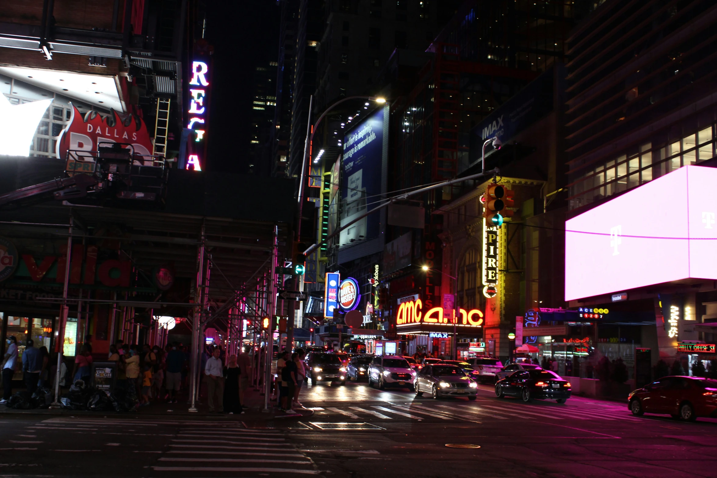 a city street that has some lights and cars