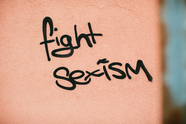 a black and white po with the word fight sexism written on it